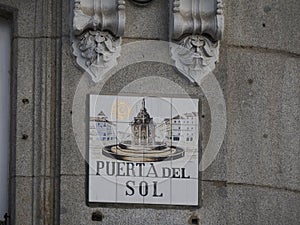 MADRID, SPAIN - DECEMBER 14, 2022: Street name sign Puerta del sol on in Madrid, capital of Spain renowned for its rich photo