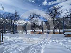 MADRID, SPAIN - JANUARY 9, 2021. Sports facilities covered by the layer of fallen white snow in Madrid, Spain. Sunny and cold day.