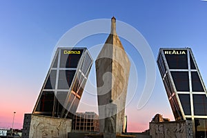 Gate of Europe KIO Towers and Obelisk of Calatrava at Paseo de la Castellana street in City of Madrid, Spain