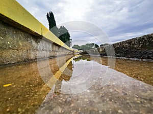 Madrid, Spain- September 13, 2022: Sports stands reflected in the puddles after the storm.