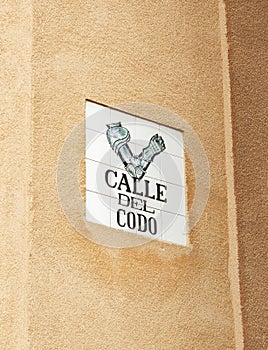 Madrid, Spain, a Sign with the name of a city street  Calle del codo - street of the elbow. photo