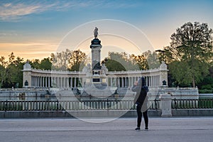 Madrid Spain, sunrise at El Retiro Park with woman tourist