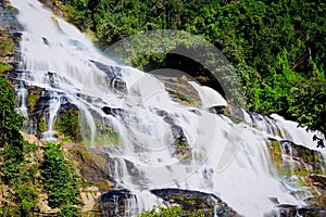 Mae Ya waterfall, beautiful cascade waterfall flowing in tropical rainforest, cataract at Doi Inthanon national park, Chiang Mai,