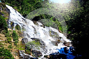 Mae Ya waterfall, beautiful cascade waterfall flowing in tropical rainforest, cataract at Doi Inthanon national park, Chiang Mai,