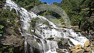 Mae Ya Waterfall is a large beautiful waterfall in a deep forest at Doi Inthanon National Park, Chiang Mai, Thailand.