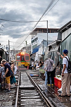 Maeklong Railway Market as Train is passing by