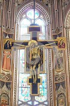 Maestro Di FiglineÃ¢â¬â¢s painted wooden crucifix above the Main Altar in the Basilica di Santa Croce in Florence photo