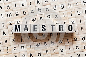 Maestro word concept on cubes photo