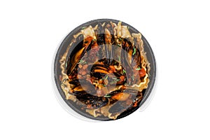 Mafaldine pasta with mussels and tomato sauce. Isolated, white background. Top view.