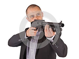 Mafia man is holding a shotgun