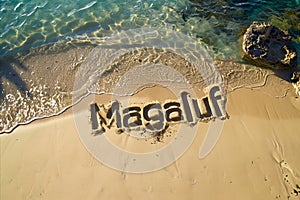 Magaluf, Spain written in the sand on a beach. Spanish tourism and vacation background photo