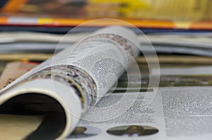 A magazine opened, in shallow focus