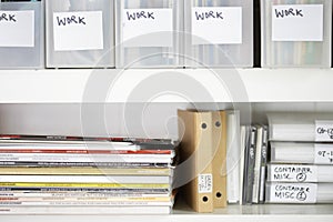 Magazines And Folders In Organized Shelves