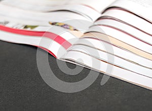 Magazines open on table