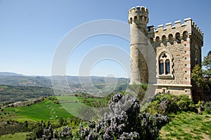 Magdala tower in front of a green meadow in Rennes-le-Chateau, France