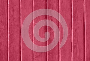 Magenta painted wooden wall background.
