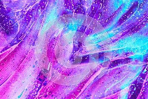Magenta pink, purple space alien glitter slime gel background texture