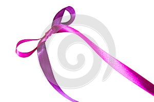 Magenta (purple)fabric ribbon and bow isolated on a white background