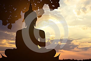 Magha Asanha Visakha Puja Day , Silhouette Buddha on golden sunset background