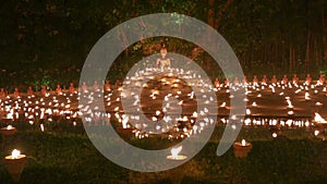 Magha puja day, Monks light the candle for buddha,