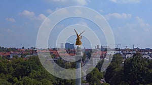 Magic aerial top view flight drone Gold Angel of Peace column City town Munich