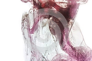 magic background with violet and pink flowing paint in water, isolated on white