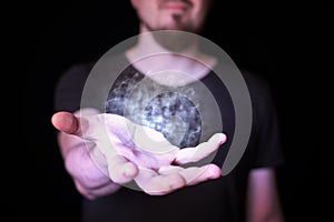 Magic ball in bearded wizard hand