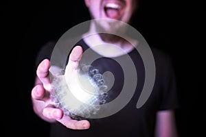 Magic ball in bearded wizard hand