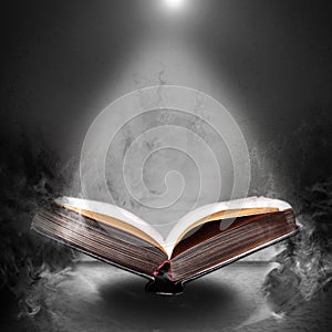 Magic book hovering in the misty haze photo