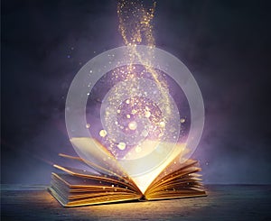 Magic Book With Open Pages And Abstract Lights Shining In Darkness