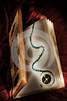 Magic book with wizard compass