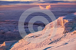 Magic breathtaking purple-pink sunrise sky over the Kilimanjaro volcano