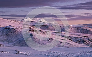 Magic breathtaking purple-pink sunrise sky over the Kilimanjaro volcano crater. 5895m high mount - the highest point of Africa and