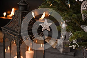 Magic Christmas tree decorated with beautiful silver balls. Nice composition and fireplace on the background