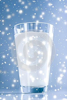 Magic holiday drink, pouring organic lactose free milk into glass on marble table