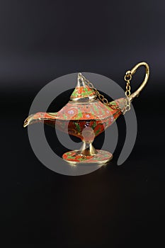 Magic lamp of Alladin on a dark and light background.