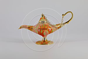 Magic lamp of Alladin on a dark and light background.