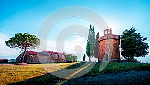 Magic landscape with chapel of Madonna di Vitaleta on a sunny day in San Quirico d`Orcia Val d`Orcia in Tuscany, Italy.