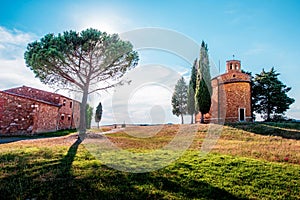 Magic landscape with chapel of Madonna di Vitaleta on a sunny day in San Quirico d`Orcia Val d`Orcia in Tuscany, Italy.