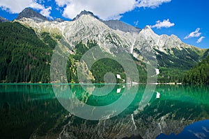 Magic landscape with peaceful alpine lake in South Tyrol