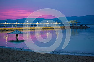 Magic lilac sunrise at the Dead Sea photo