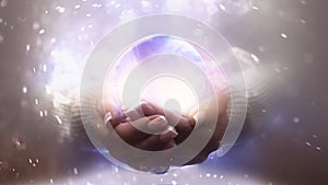 Magic particles emanating from female hands.