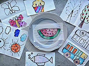 Magic in a plate of water, drawings of children`s shows will appear multicolored