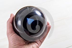 Magic prediction eight ball in hand