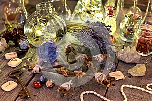 Magic ritual collection with bottles, lavender flowers, pentagram, runes and crystals