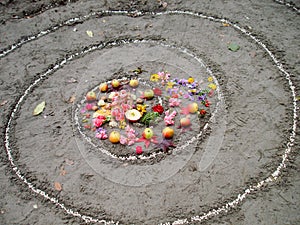 Magic spiral works next to a lake, wicca altar. Pagan religion.