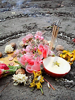 Magic spiral works next to a lake, wicca altar. Pagan religion.