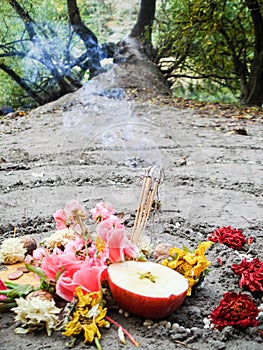 Magic spiral works next to a lake, wicca altar. Pagan religion.