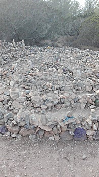 Magic stones of the hippies, put in a circle in shamanic vortices, domino effect created with earth and boulders for Ibizan