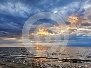 Magic sunset with cumulus clouds above the Baltic sea in Jurmala